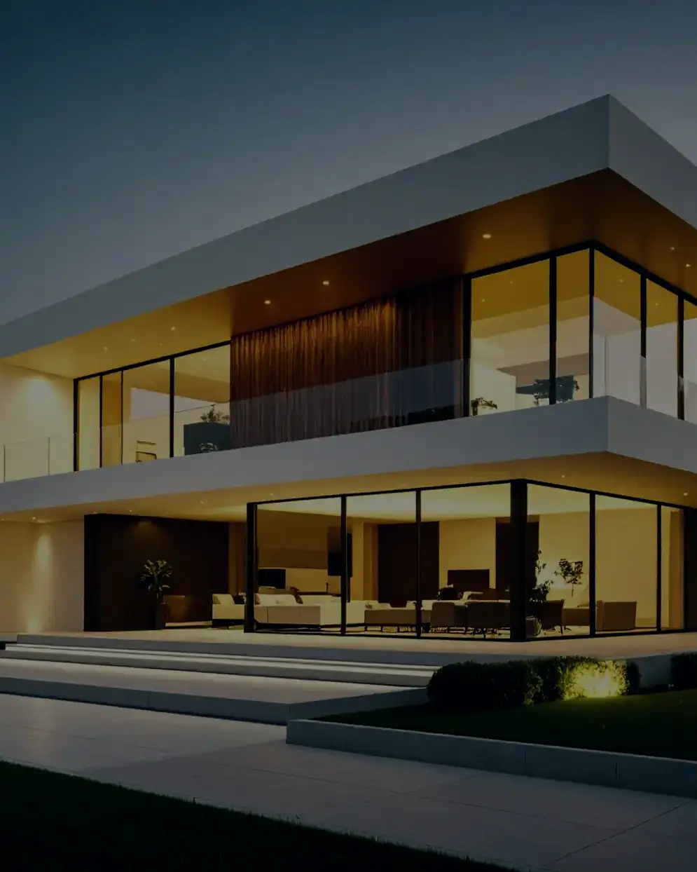 A modern West Coast home lit at dusk
