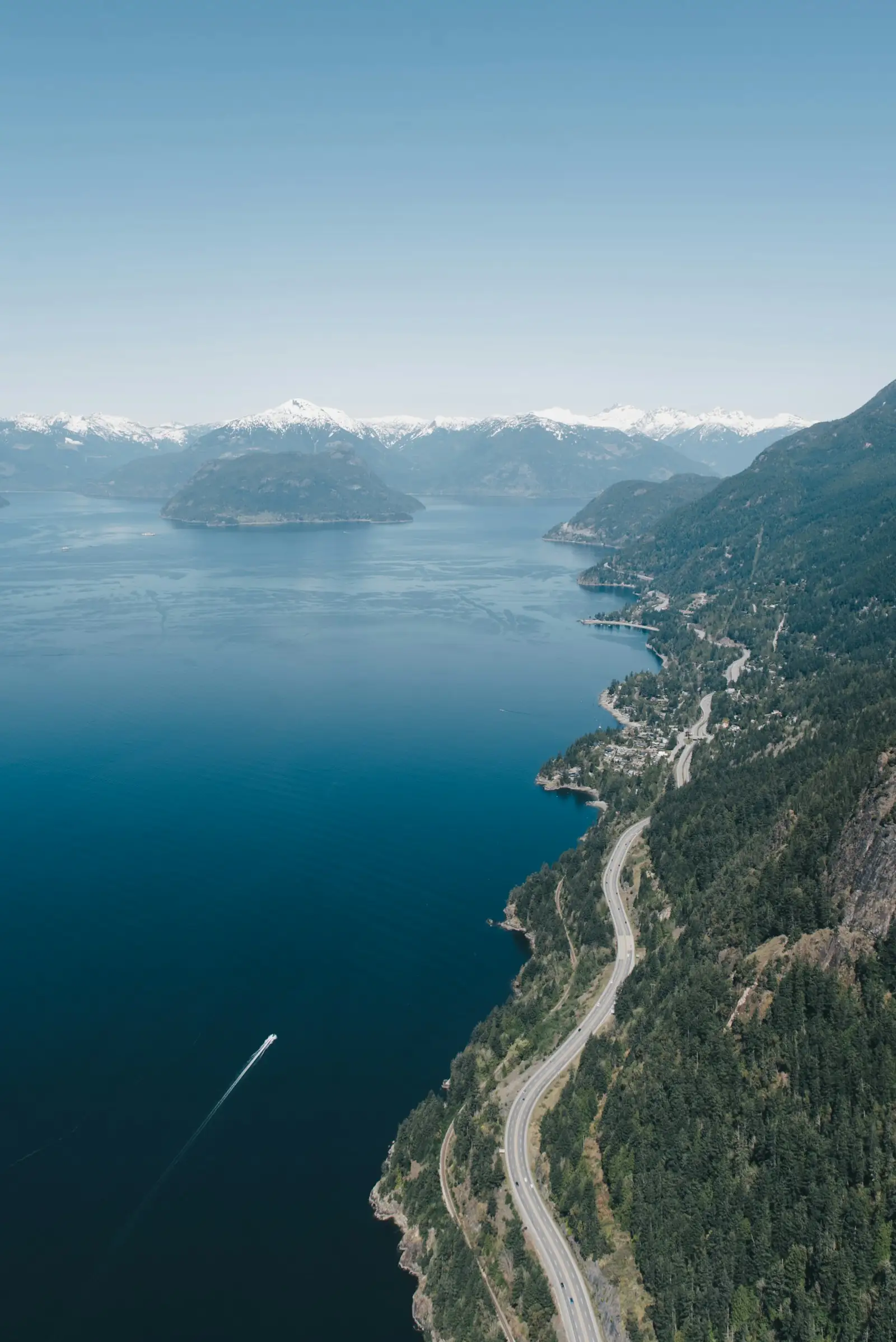 Aerial view of the highway along Howe Sound and its islands